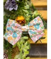 Pinza con lazada pelo niña en liberty turquesa de Mon Petit Bonbon